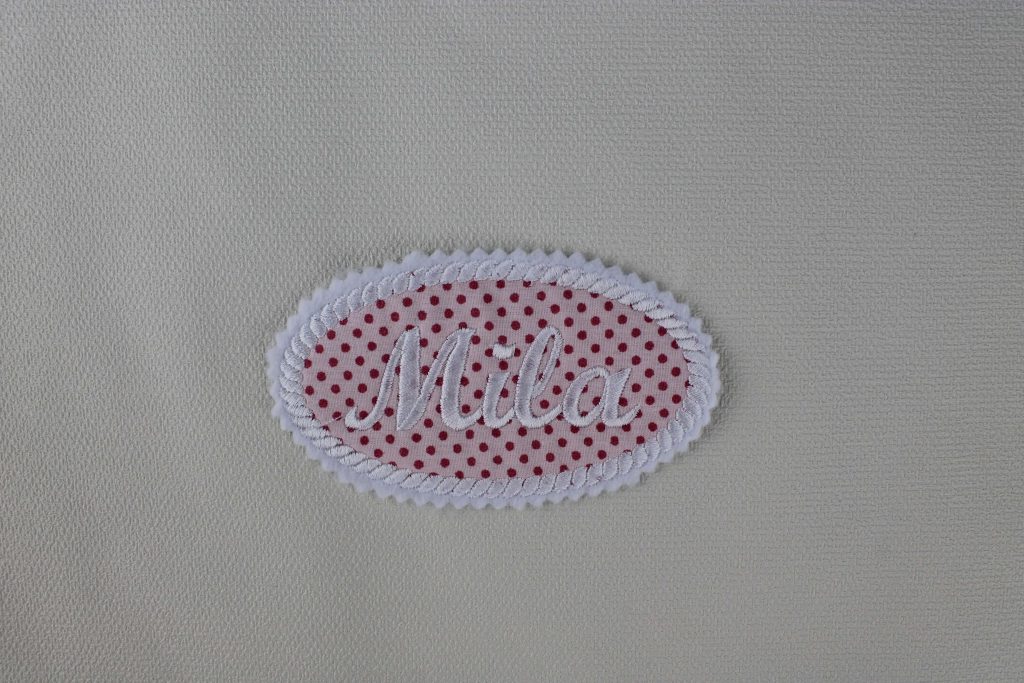 Oval patch with embroidered name
