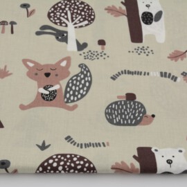 Tela de color beige  con dibujos de animales